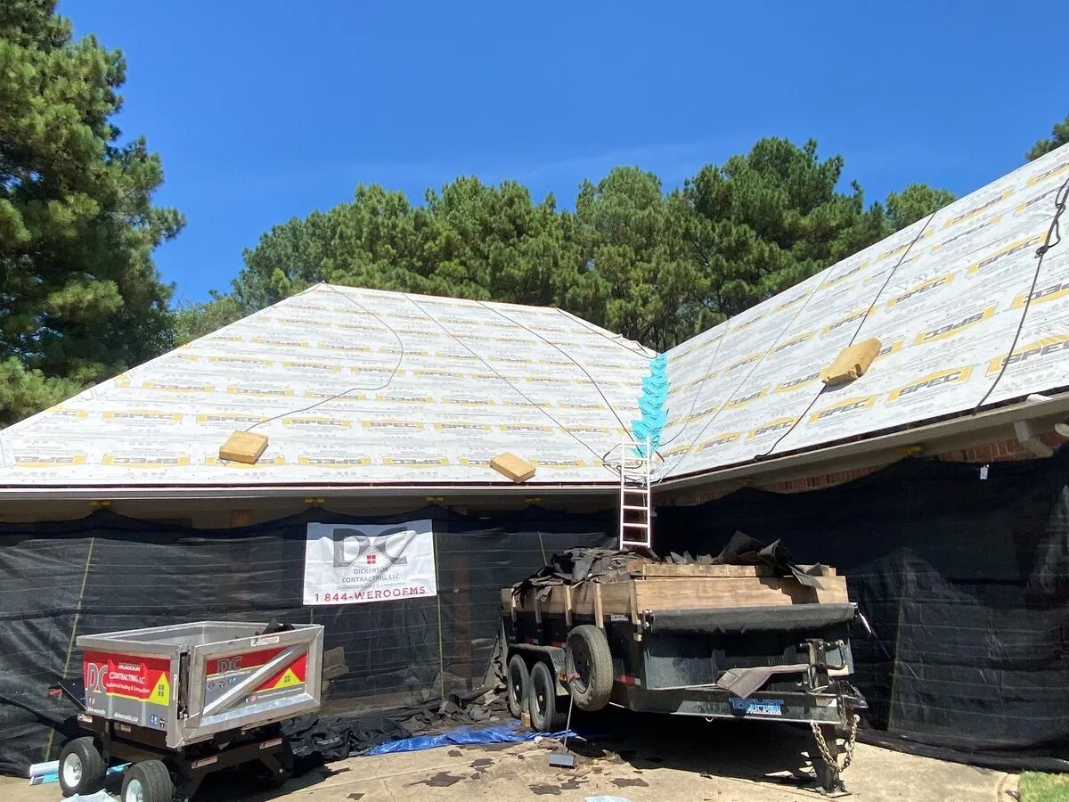 Roof dried in and walls tarped on a Dickerson storm job