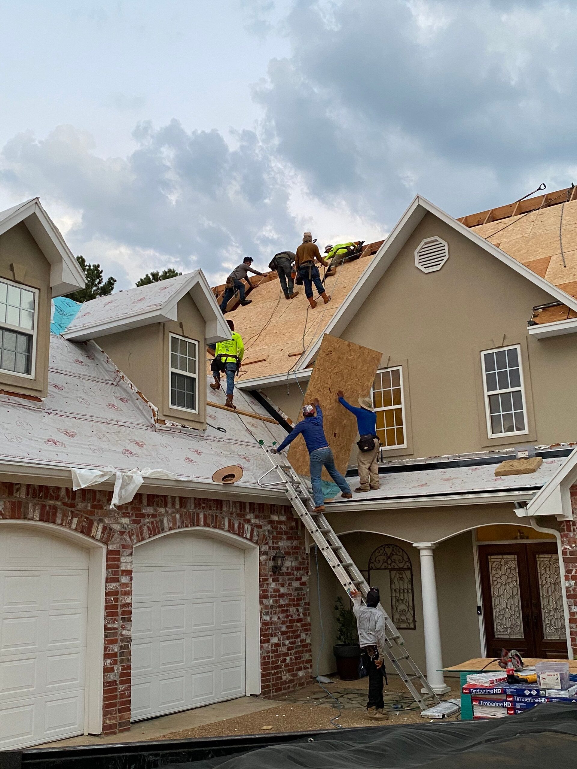 Overhead view of the Dickerson crew working together on a large roof