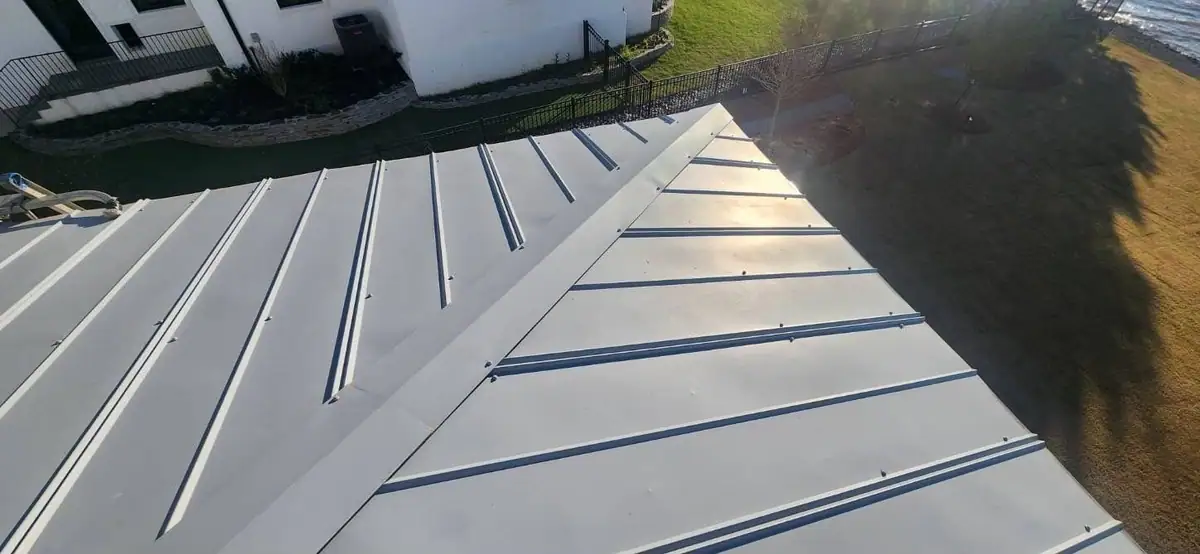Standing seam metal roof on a lake house, installed by Dickerson Contracting