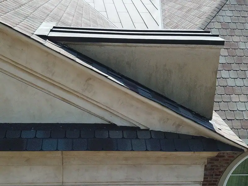 Metal flashing and cap detail on a dormer, metal roofing by Dickerson Contracting in Brandon, MS