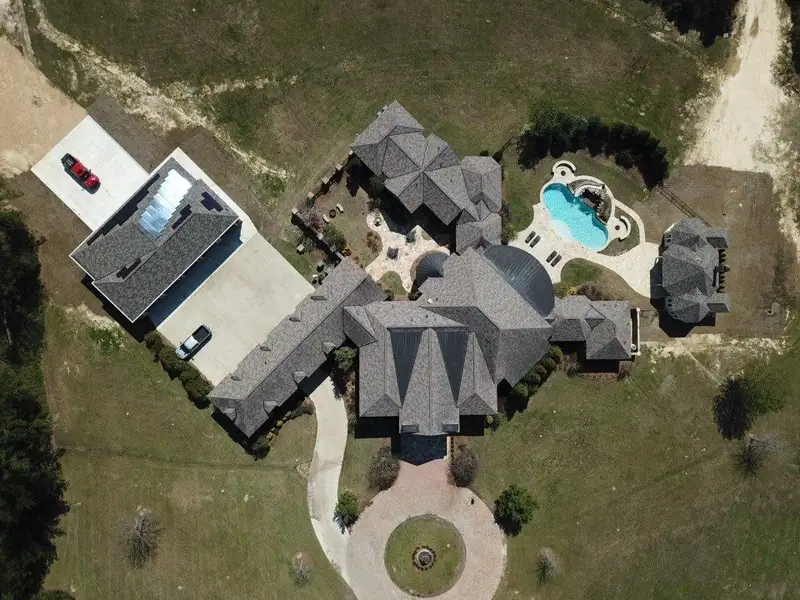 Aerial view of a finished shingle roof by Dickerson Contracting, roofing company serving Jackson, MS