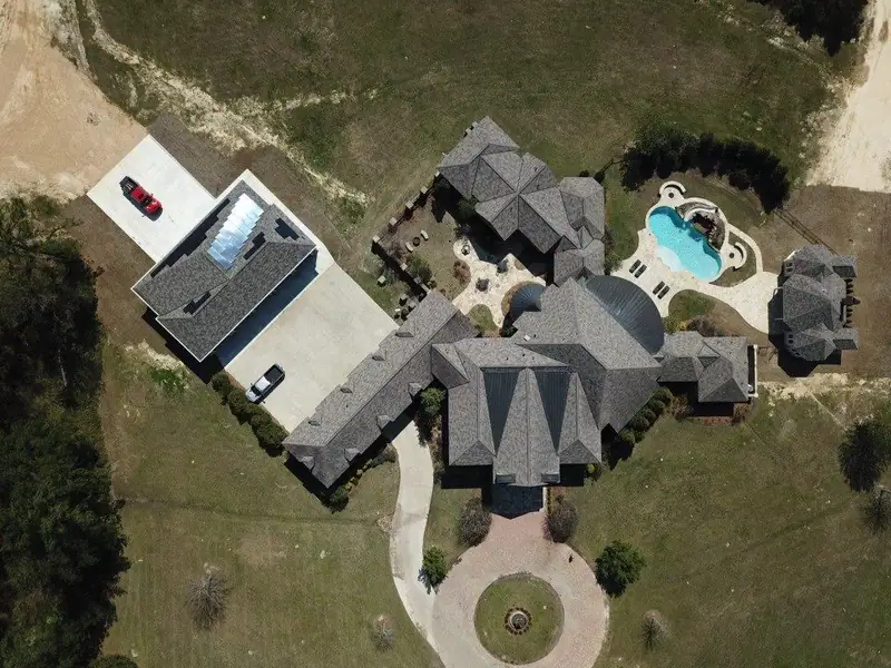 Aerial view of a finished shingle roof by Dickerson Contracting, roofing company serving Pearl, MS