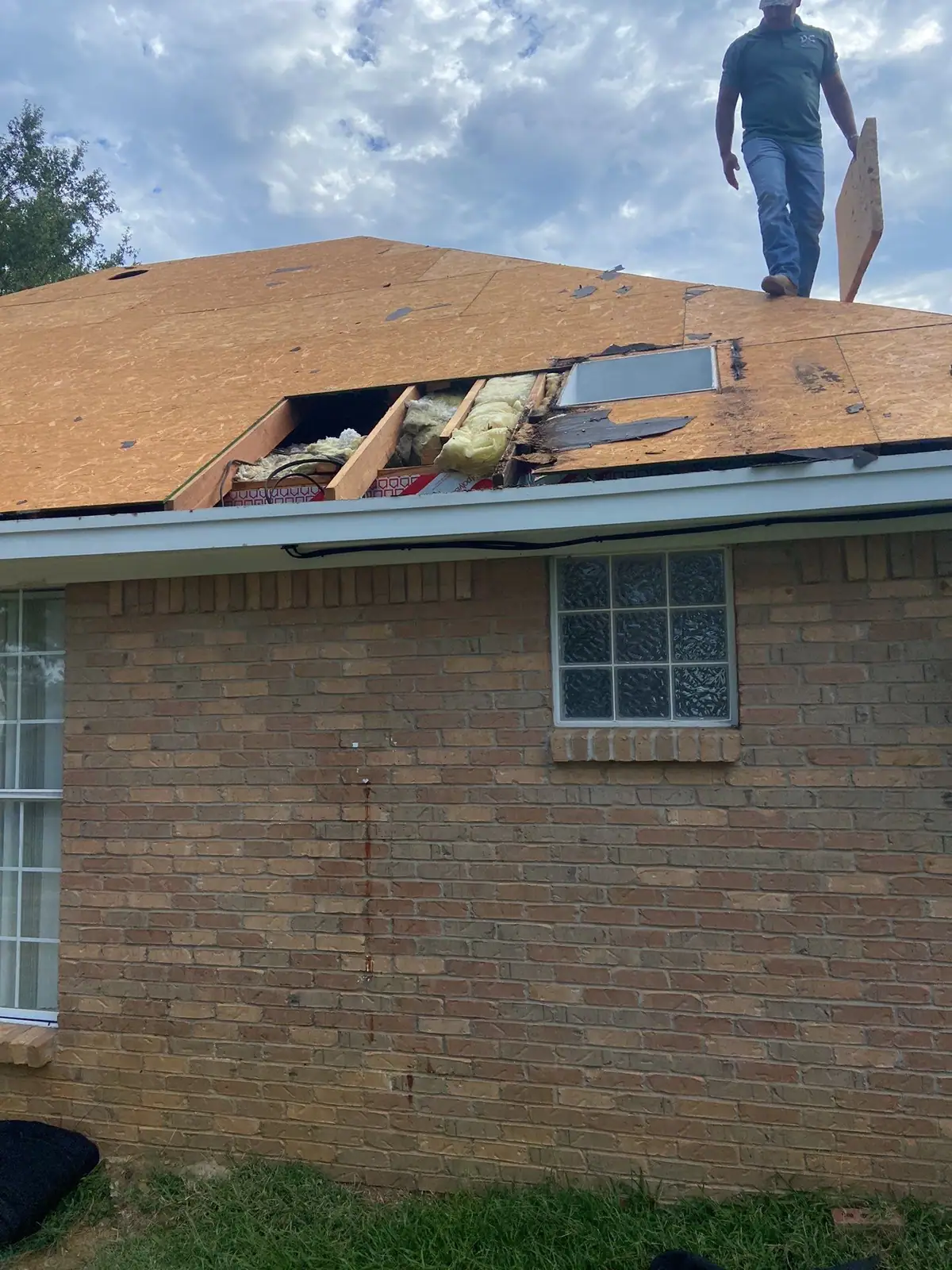 Damaged shingles on a roof before the work, roof repair by Dickerson Contracting serving Vicksburg, MS