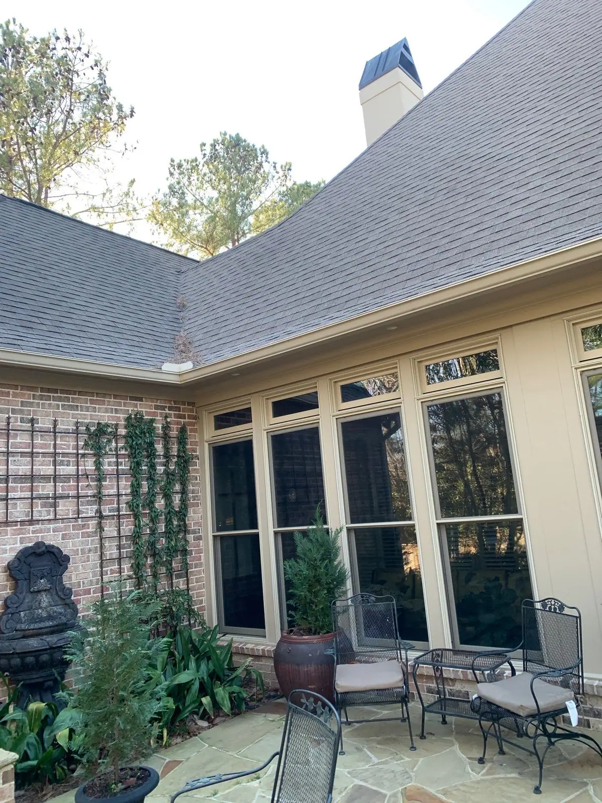 New shingle roof above freshly trimmed windows, residential roofing by Dickerson Contracting in Ridgeland, MS