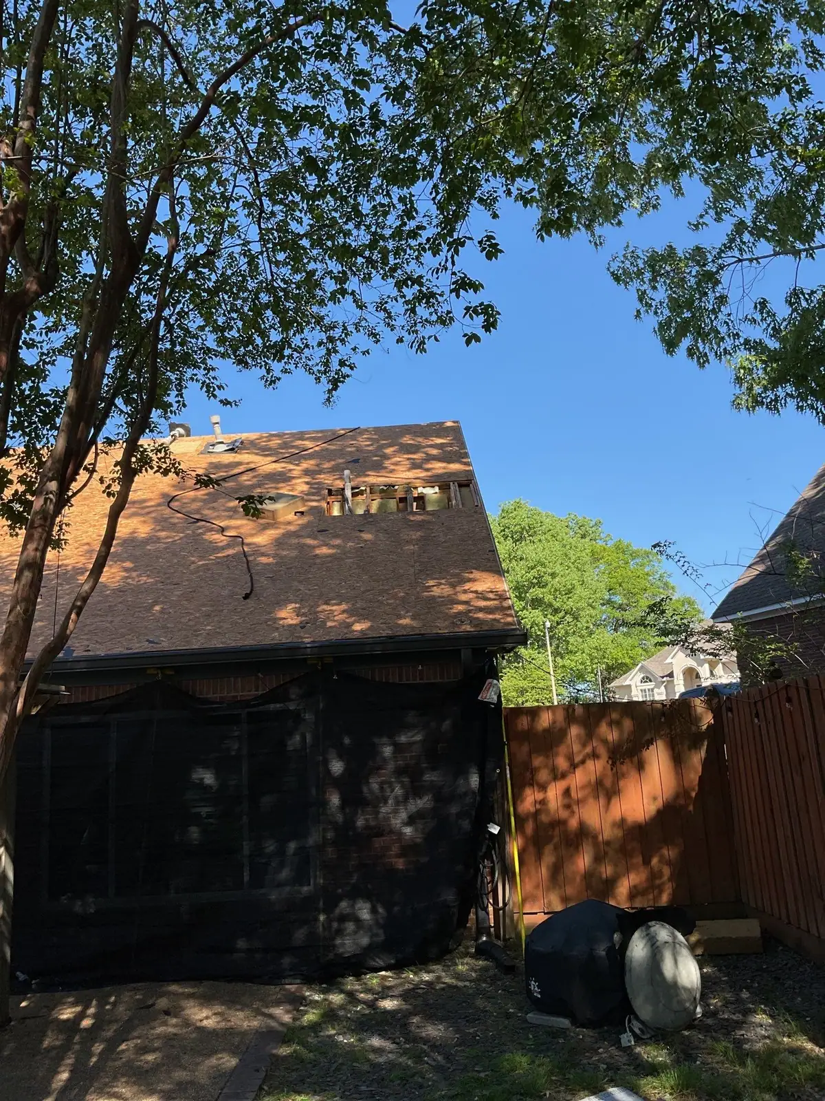 Damaged shingles on a roof before the work, roof repair by Dickerson Contracting in Madison, MS