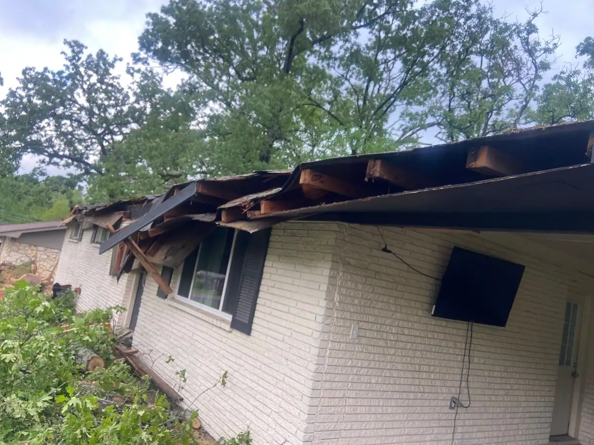Damaged roof decking opened up during a tear-off, roof repair by Dickerson Contracting in Pearl, MS