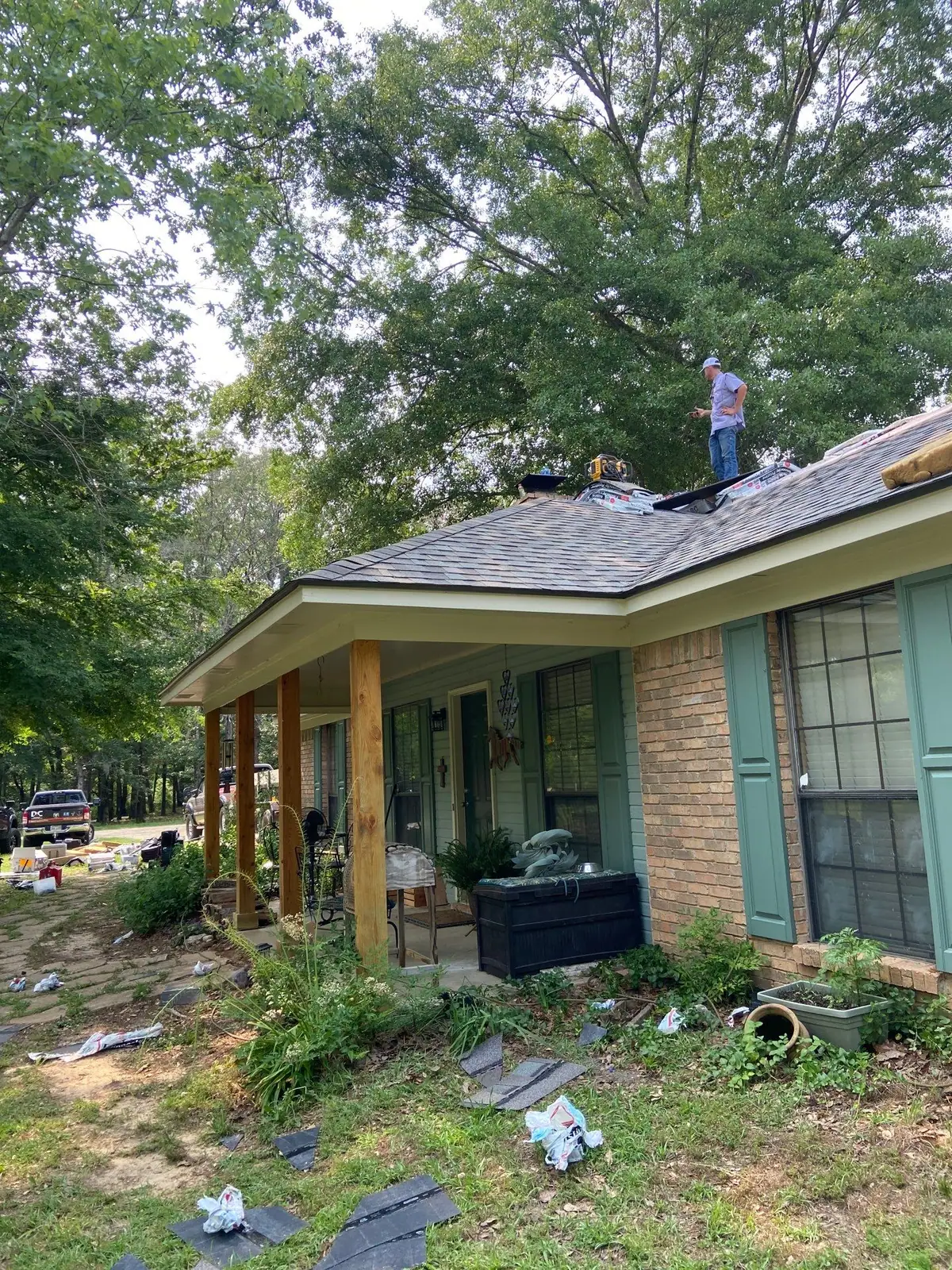 Roofers working on a shingle roof, residential roofing by Dickerson Contracting in Jackson, MS