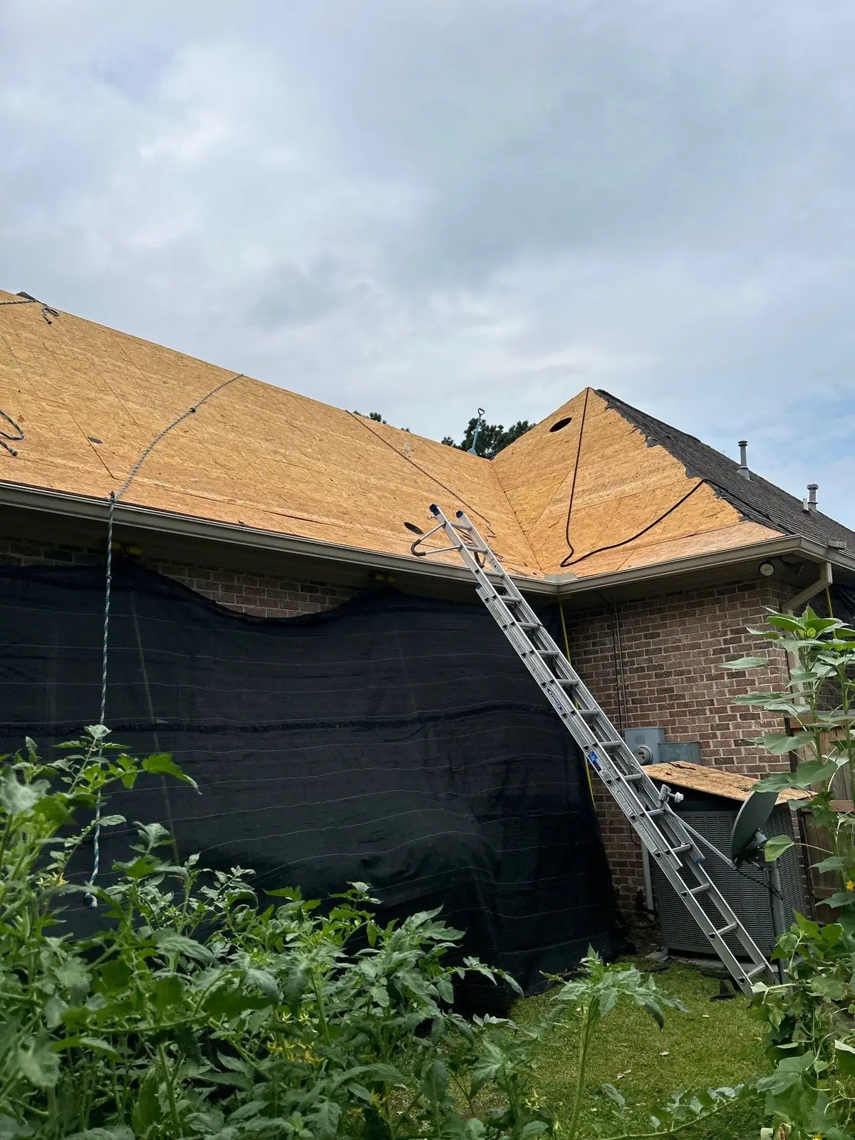 Old roof decking opened up for replacement, residential roofing by Dickerson Contracting in Ridgeland, MS