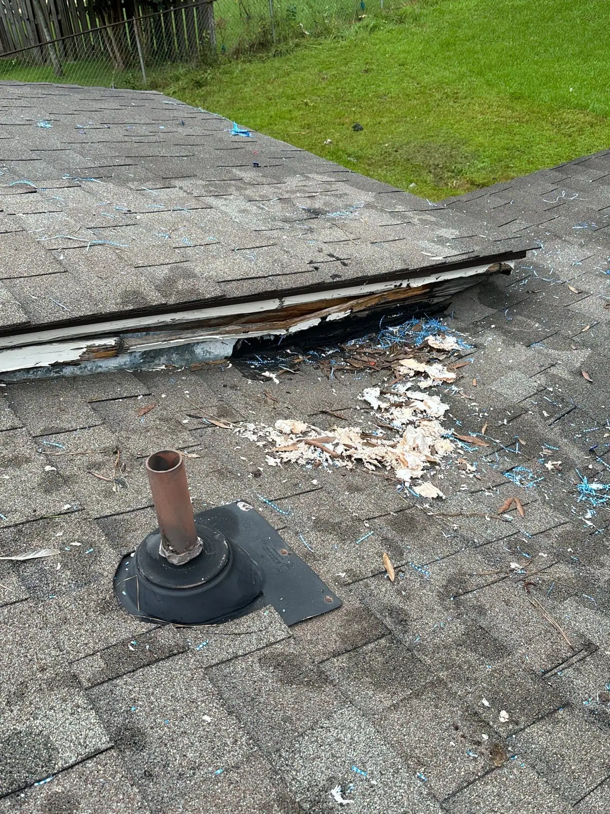 Damaged shingles on a roof before the work, roof repair by Dickerson Contracting in Pearl, MS