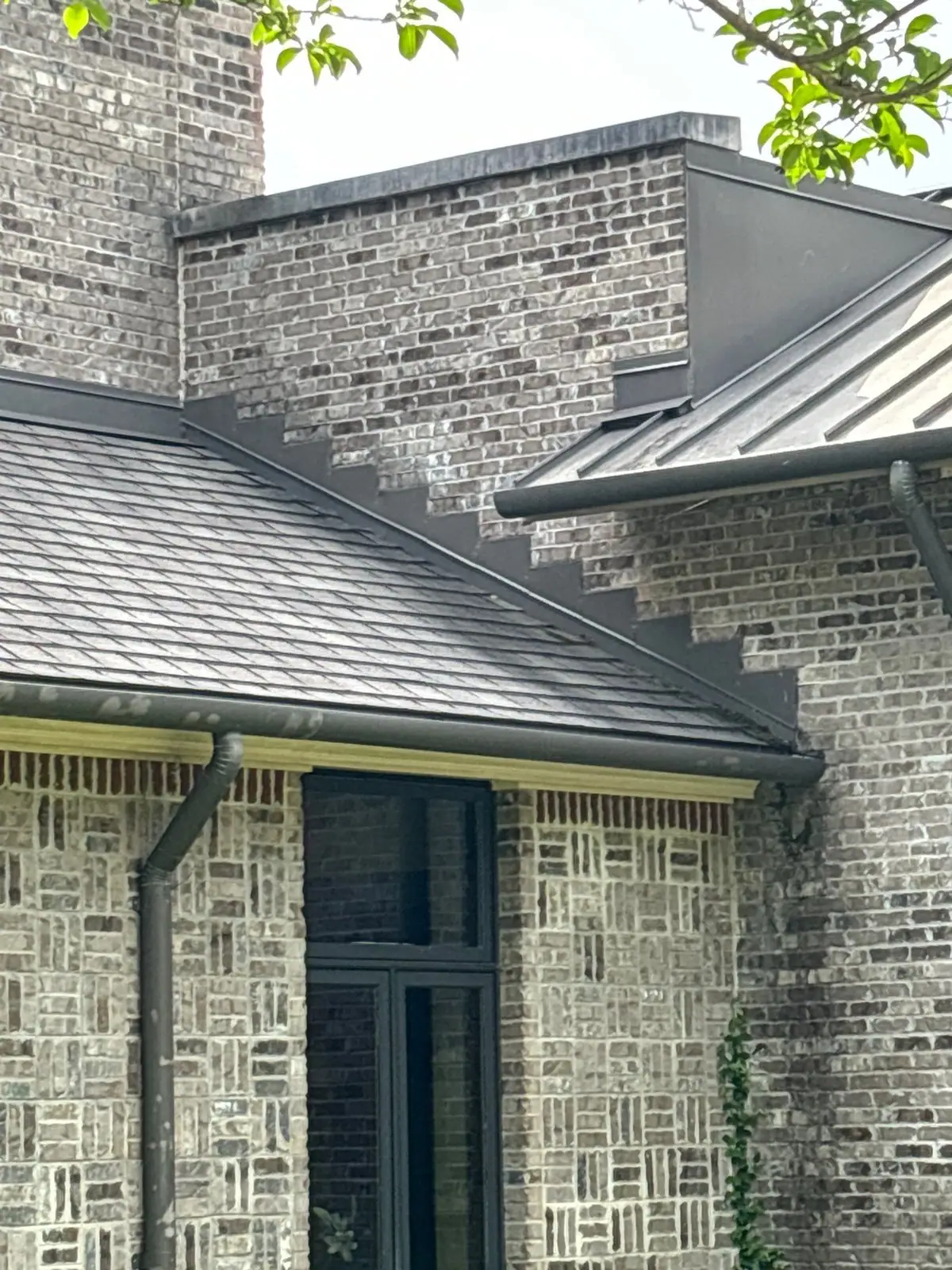 New shingle roof edge with gutters, roof repair and replacement by Dickerson Contracting in Ridgeland, MS