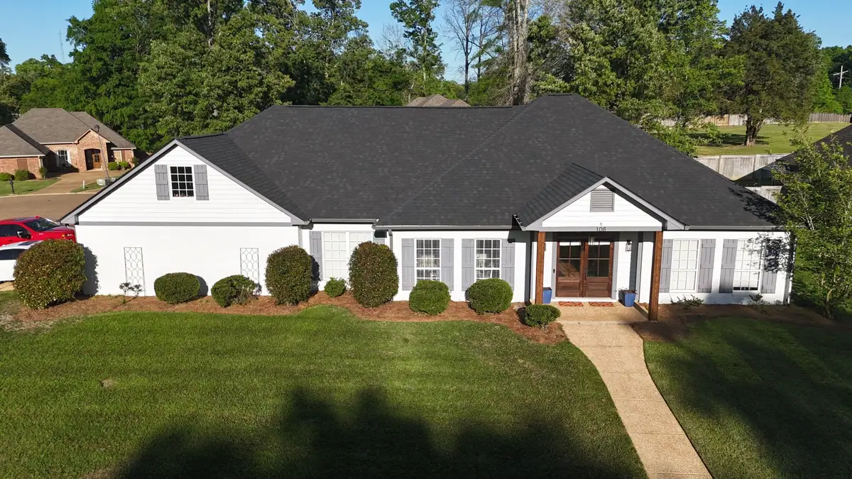 Single-story home with a new dark shingle roof