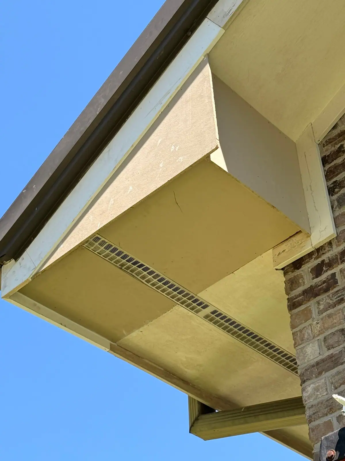 Finished soffit corner with new fascia and vent strip, by Dickerson Contracting