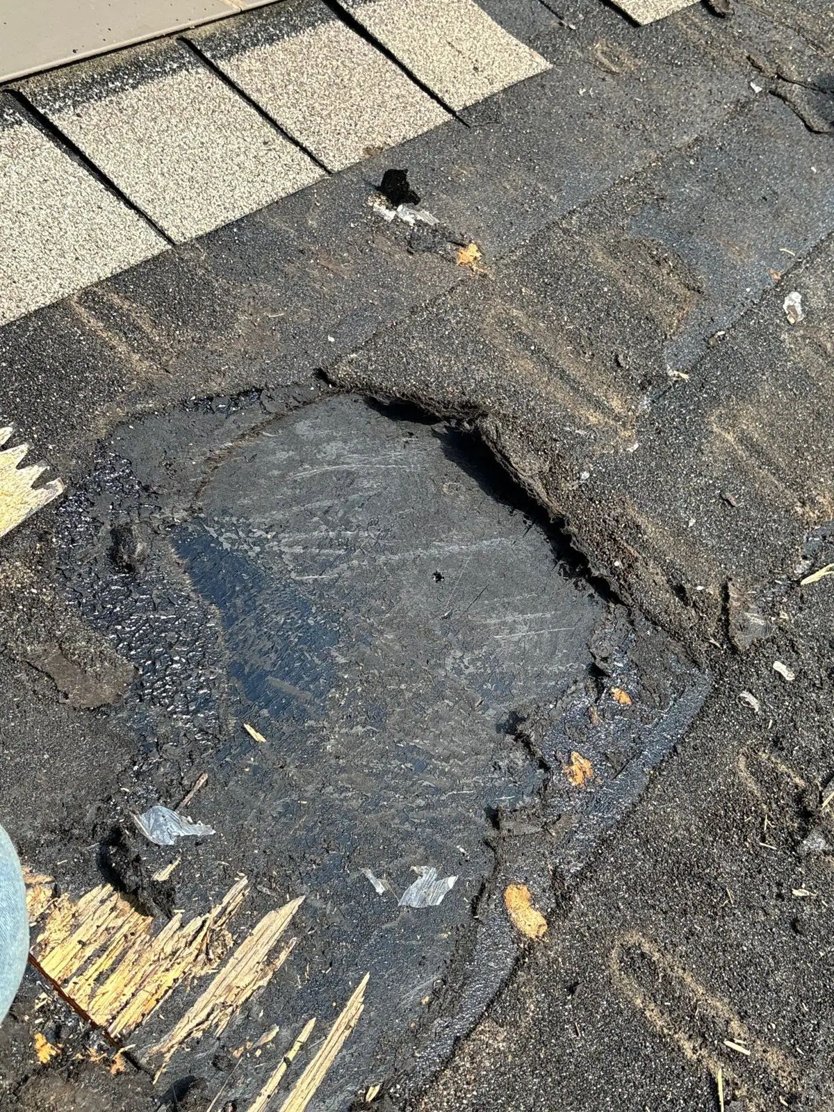 Damaged shingles on a roof before the work, roof repair by Dickerson Contracting in Ridgeland, MS