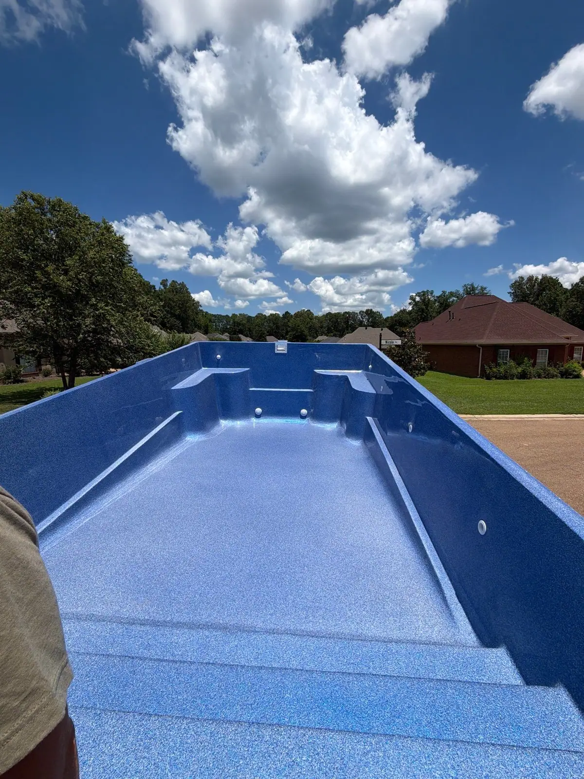 Finished pool and concrete deck, fiberglass pools by DC Pools and Spas serving Flowood, MS