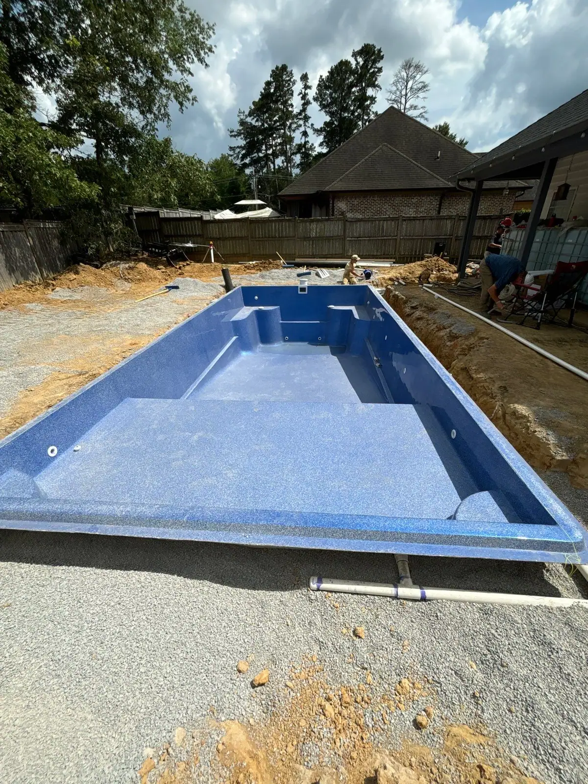 Finished fiberglass pool and concrete deck by DC Pools and Spas, pool company serving Ridgeland, MS