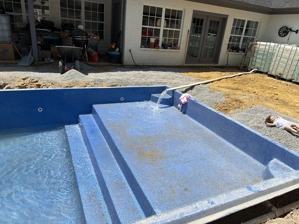 Finished pool and concrete deck, fiberglass pools by DC Pools and Spas in Brandon, MS