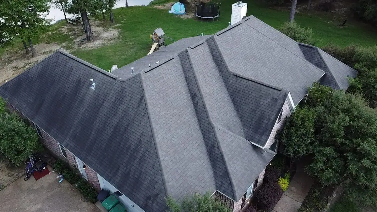 Finished shingle roof on a brick home, seen from a drone, by roofing company Dickerson Contracting