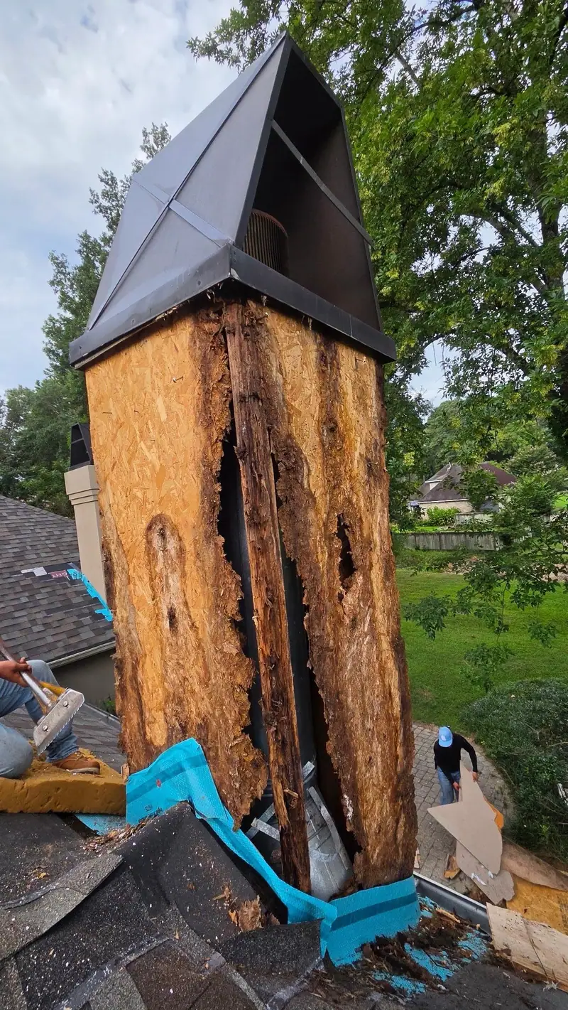 Rotted wood chimney chase exposed during a roof repair