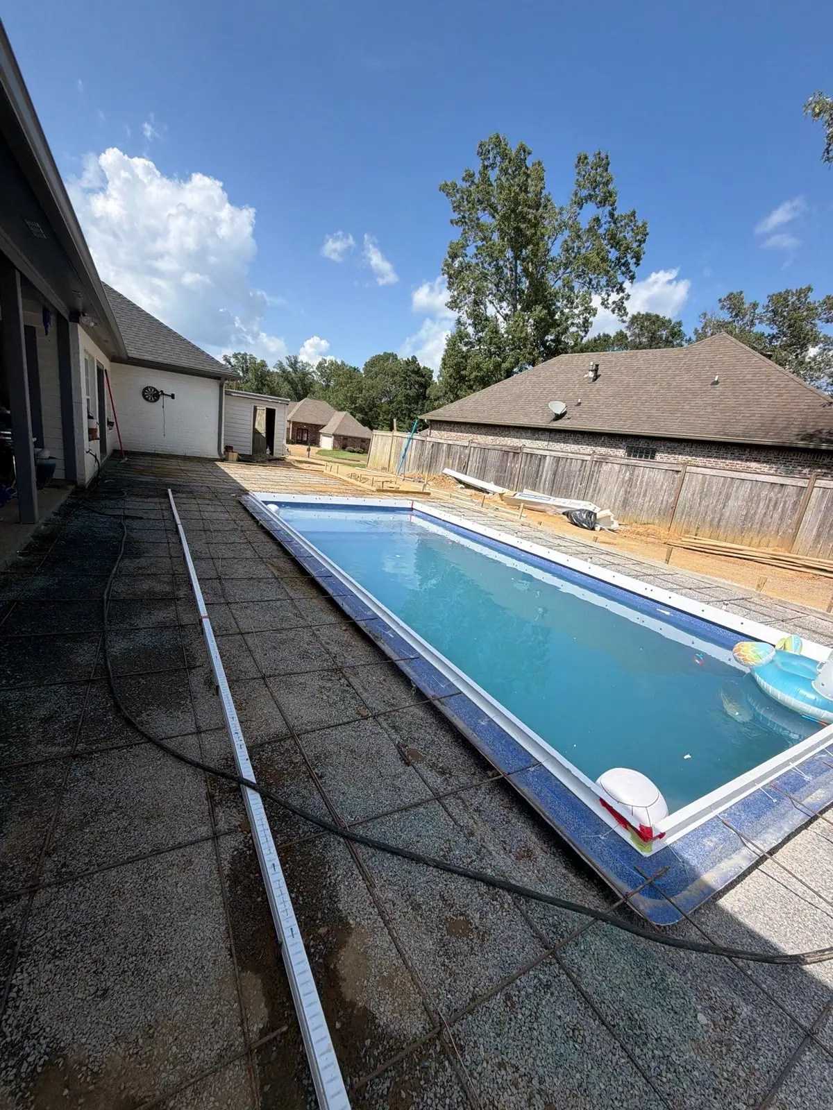 Finished fiberglass pool and concrete deck by DC Pools and Spas, pool company serving Vicksburg, MS