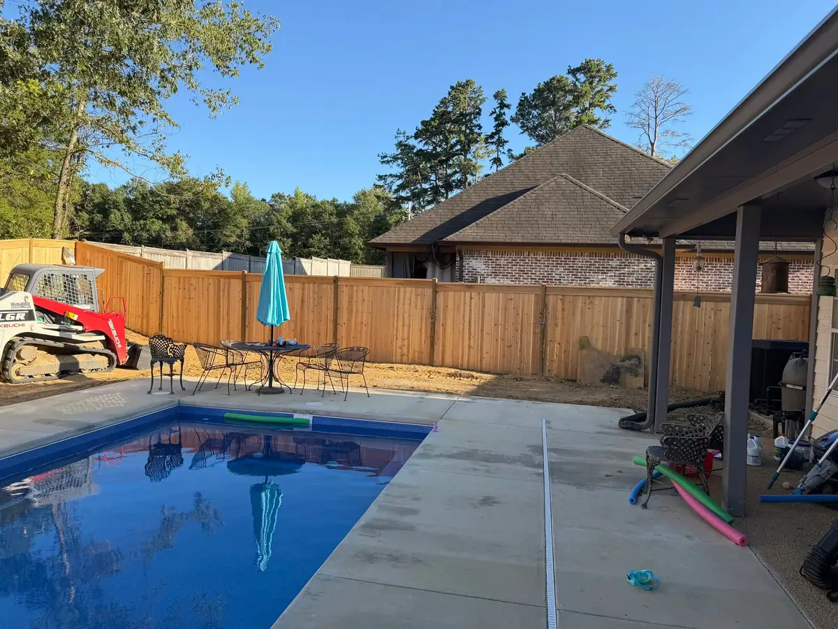 Finished fiberglass pool and concrete deck by DC Pools and Spas, pool company serving Pearl, MS