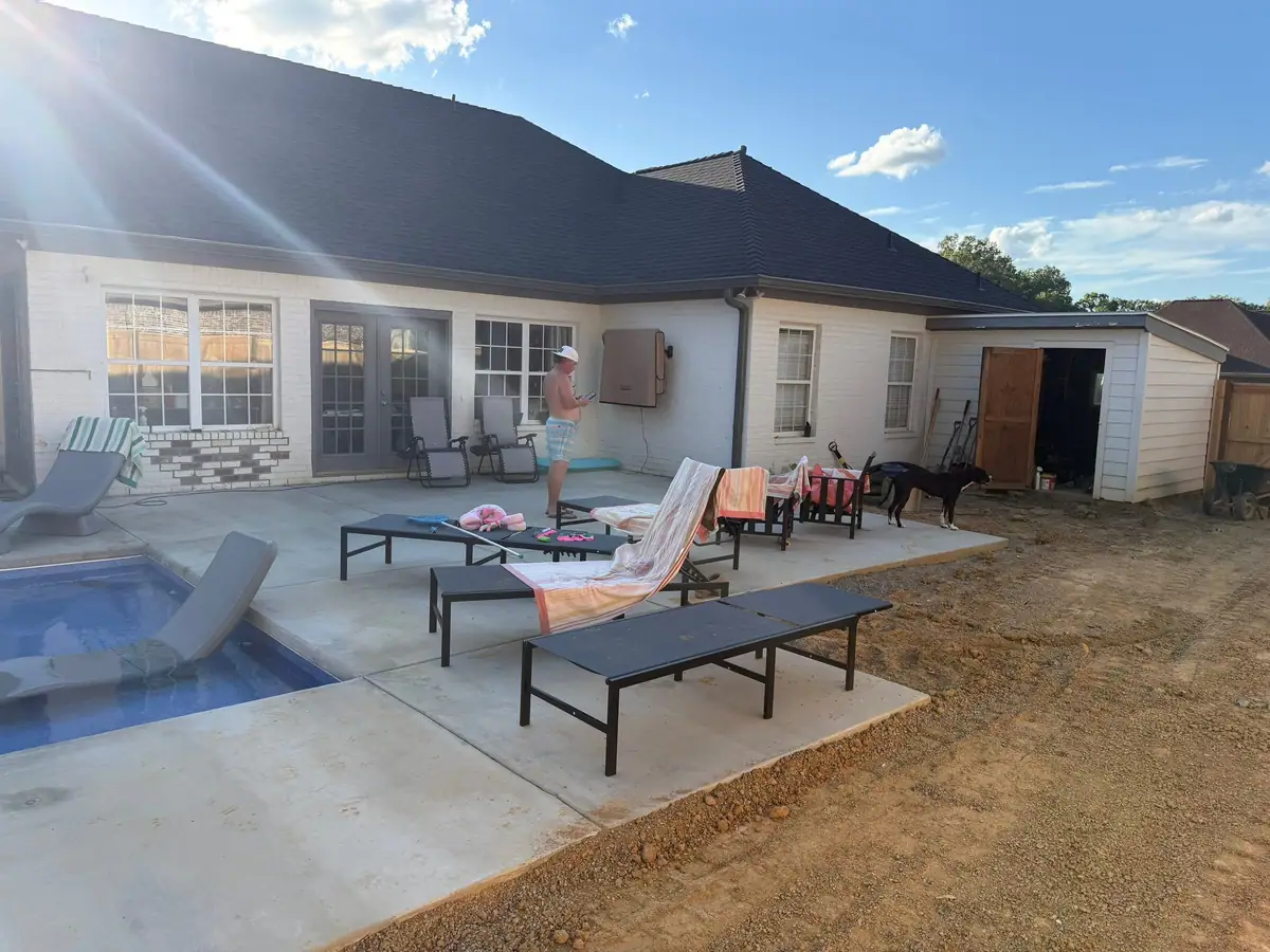 Finished inground pool and concrete deck by DC Pools and Spas in Brandon, MS