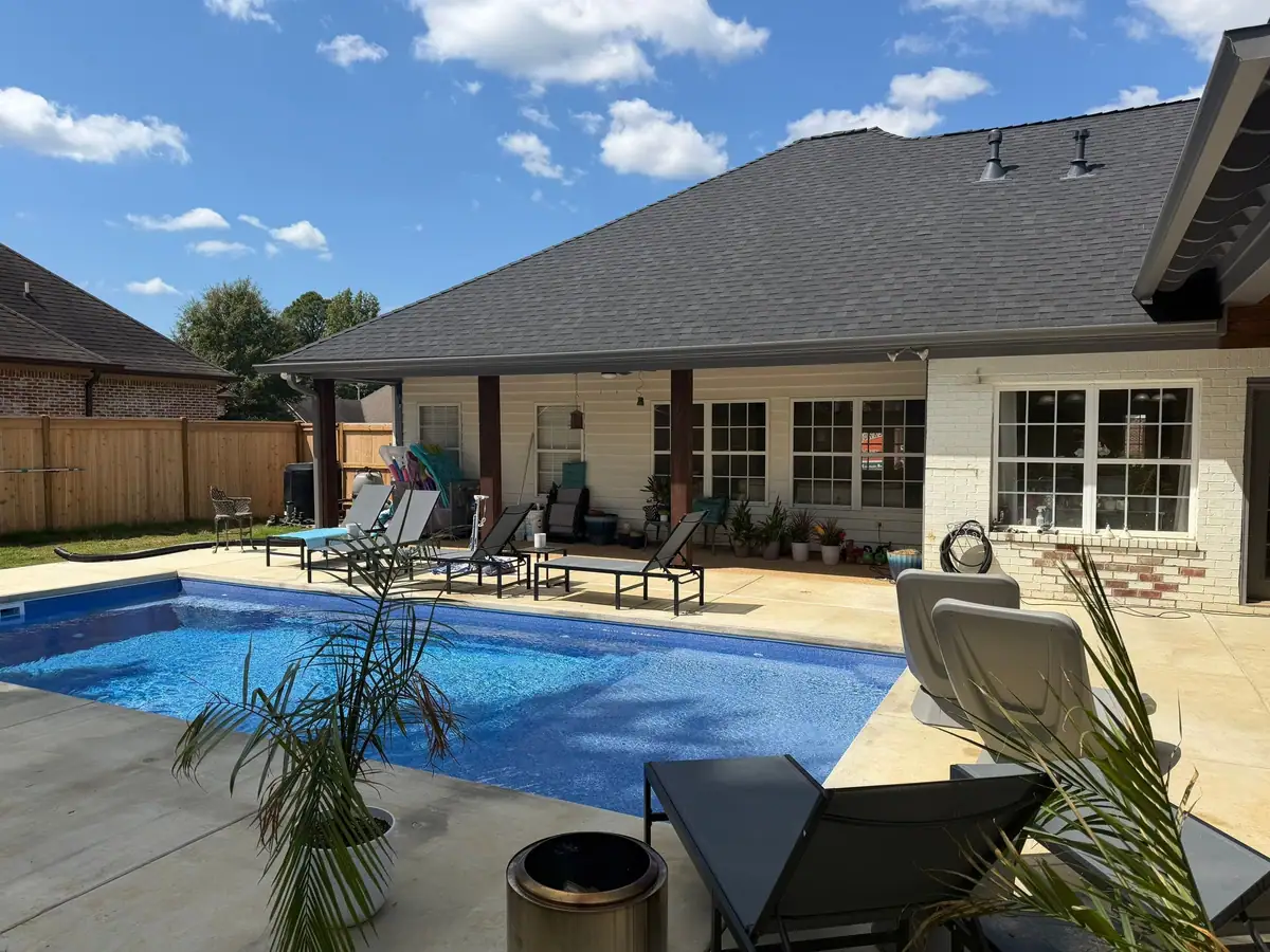 Finished fiberglass pool and concrete deck by DC Pools and Spas, pool company serving Jackson, MS