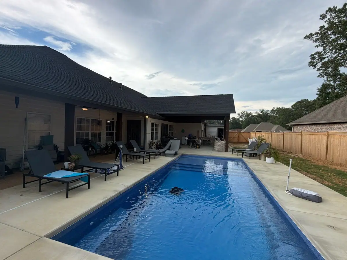Finished fiberglass pool and concrete deck by DC Pools and Spas, pool company in Brandon, MS