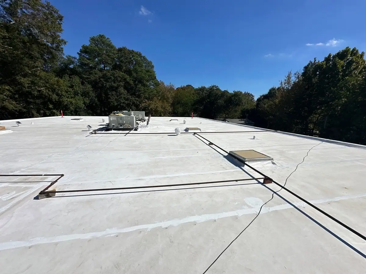 White TPO flat roof with new skylight curbs, commercial roofing by Dickerson Contracting serving Brandon, MS