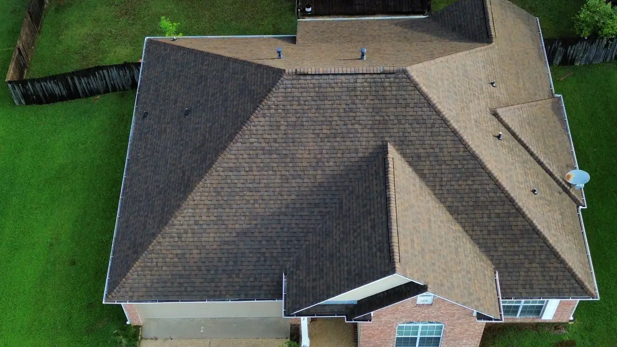 Aerial view of a finished architectural shingle roof on a brick home, residential roofing in Clinton, MS
