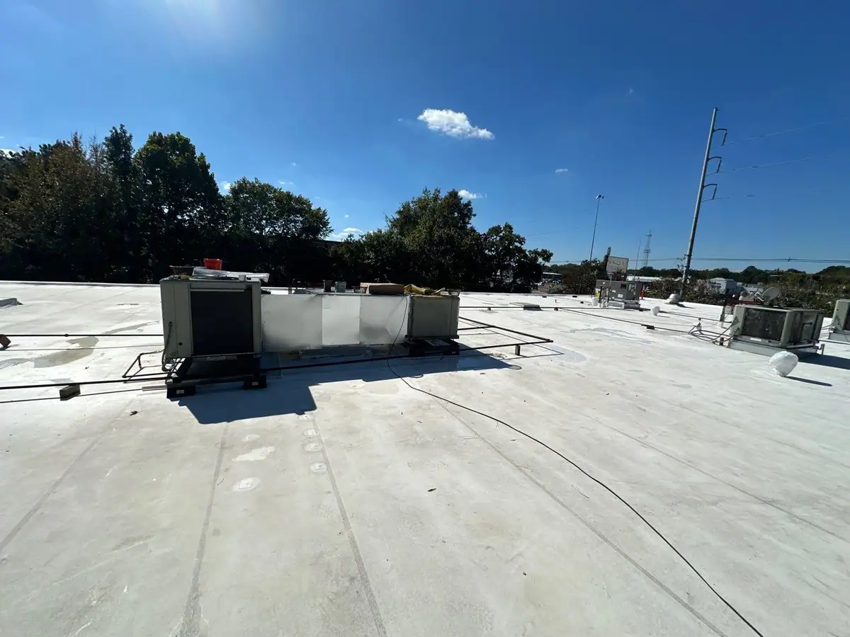Finished white TPO roof with rooftop HVAC units, commercial roofing by Dickerson Contracting serving Flowood, MS