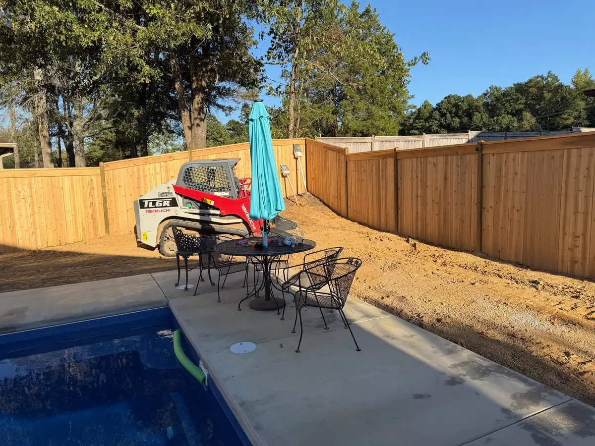 Inground fiberglass pool with patio furniture and shade umbrella, inground pools serving Flowood, MS