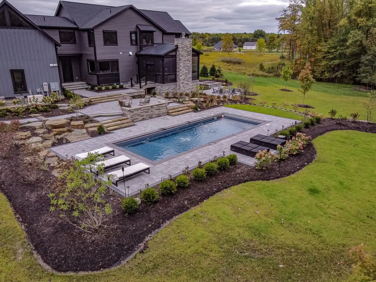 Rectangular fiberglass pool in a landscaped lawn (Latham photo), an inground pool DC Pools installs serving Flowood, MS