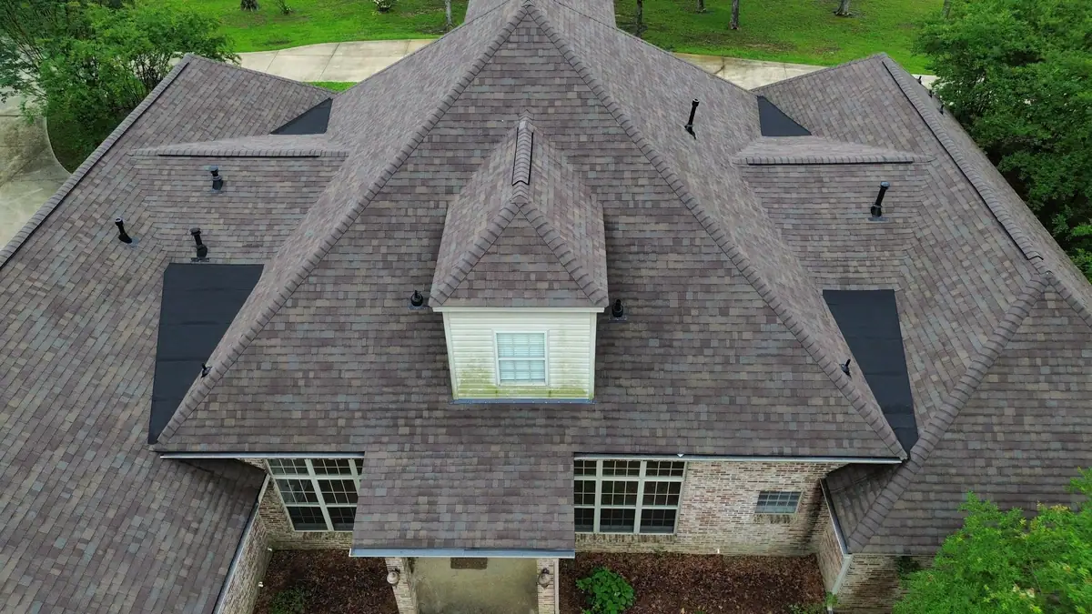 Finished shingle roof with a center dormer on a brick home, residential roofing by Dickerson Contracting serving Jackson, MS