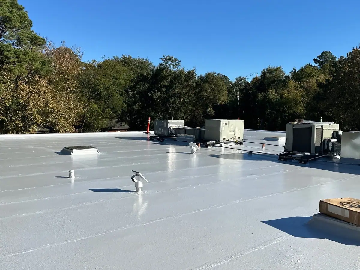 Newly finished white flat roof with rooftop units, commercial roofing by Dickerson Contracting serving Ridgeland, MS