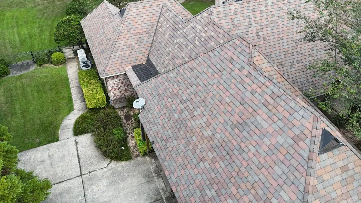 Finished multi-tone shingle roof over a landscaped yard, residential roofing by Dickerson Contracting serving Ridgeland, MS