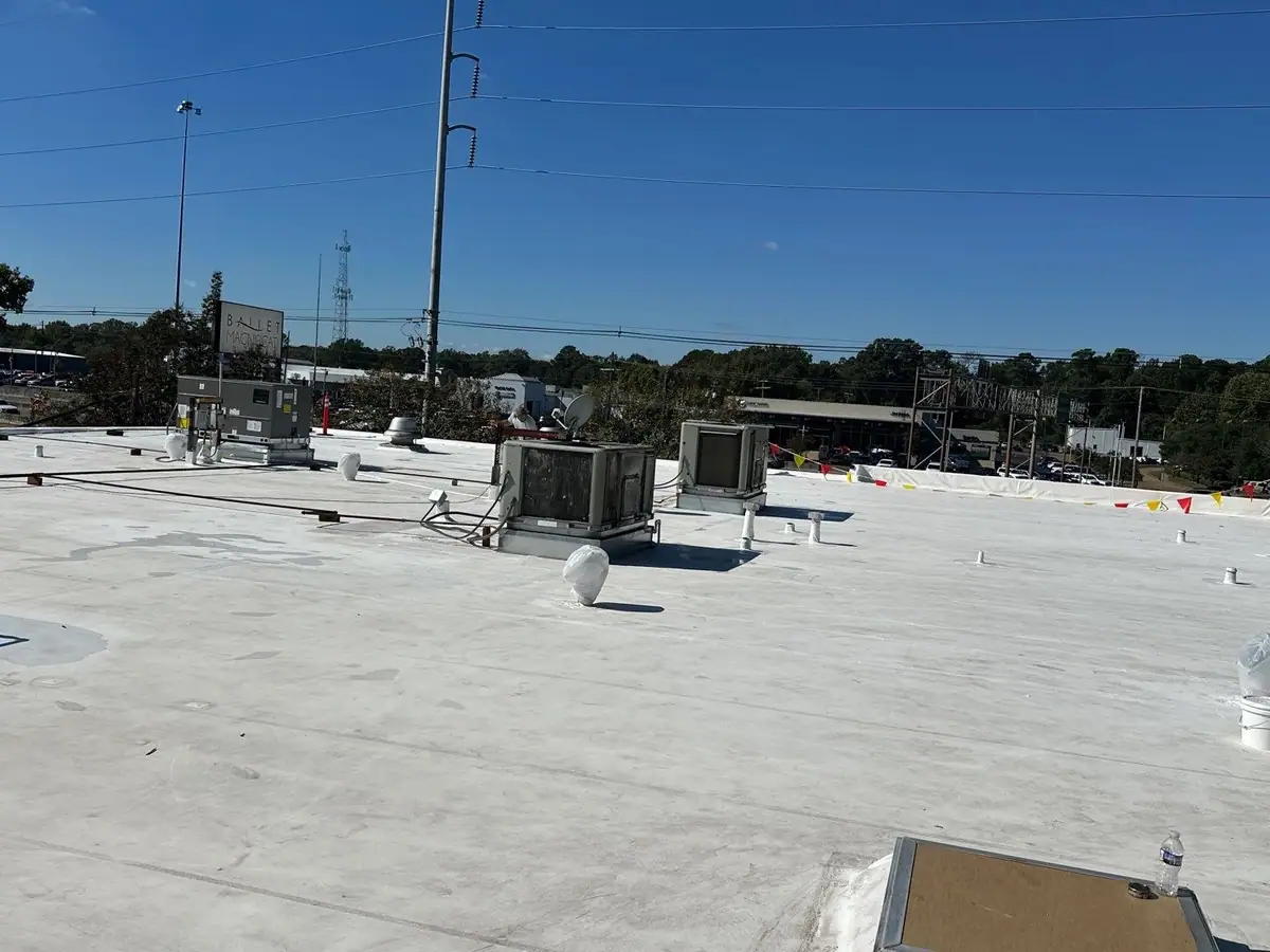White TPO flat roof with rooftop units, commercial roofing by Dickerson Contracting serving Vicksburg, MS