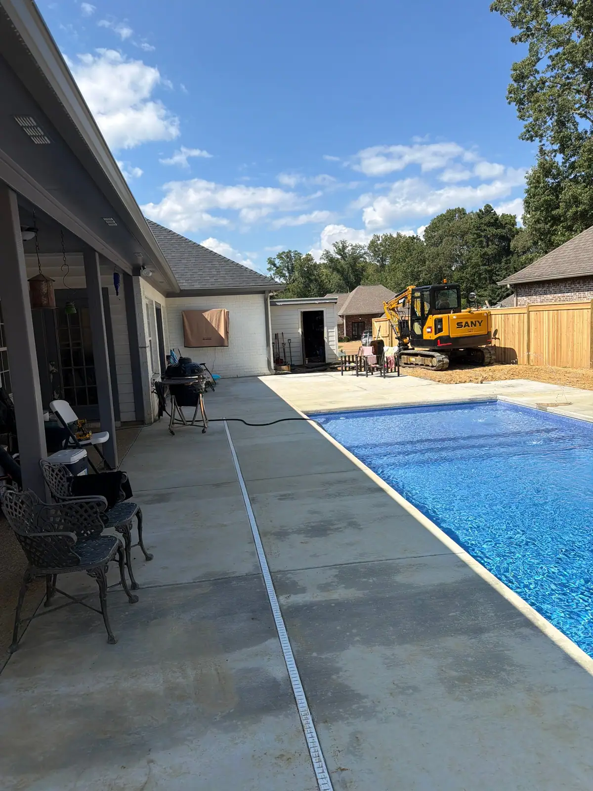Finished inground pool in a fenced backyard, DC Pools and Spas serving Vicksburg, MS