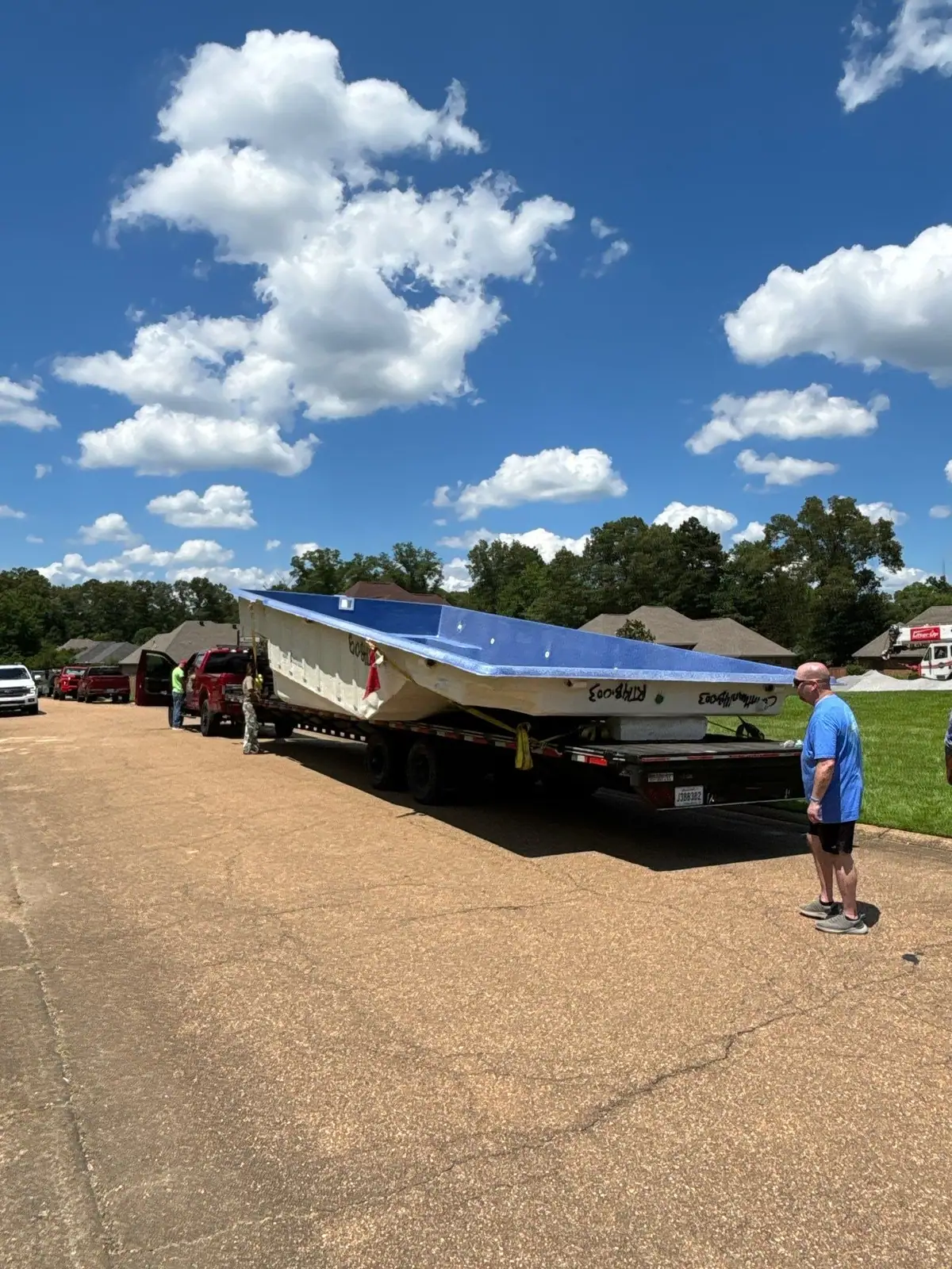 One-piece Latham fiberglass pool shell on delivery day, fiberglass pools serving Vicksburg, MS