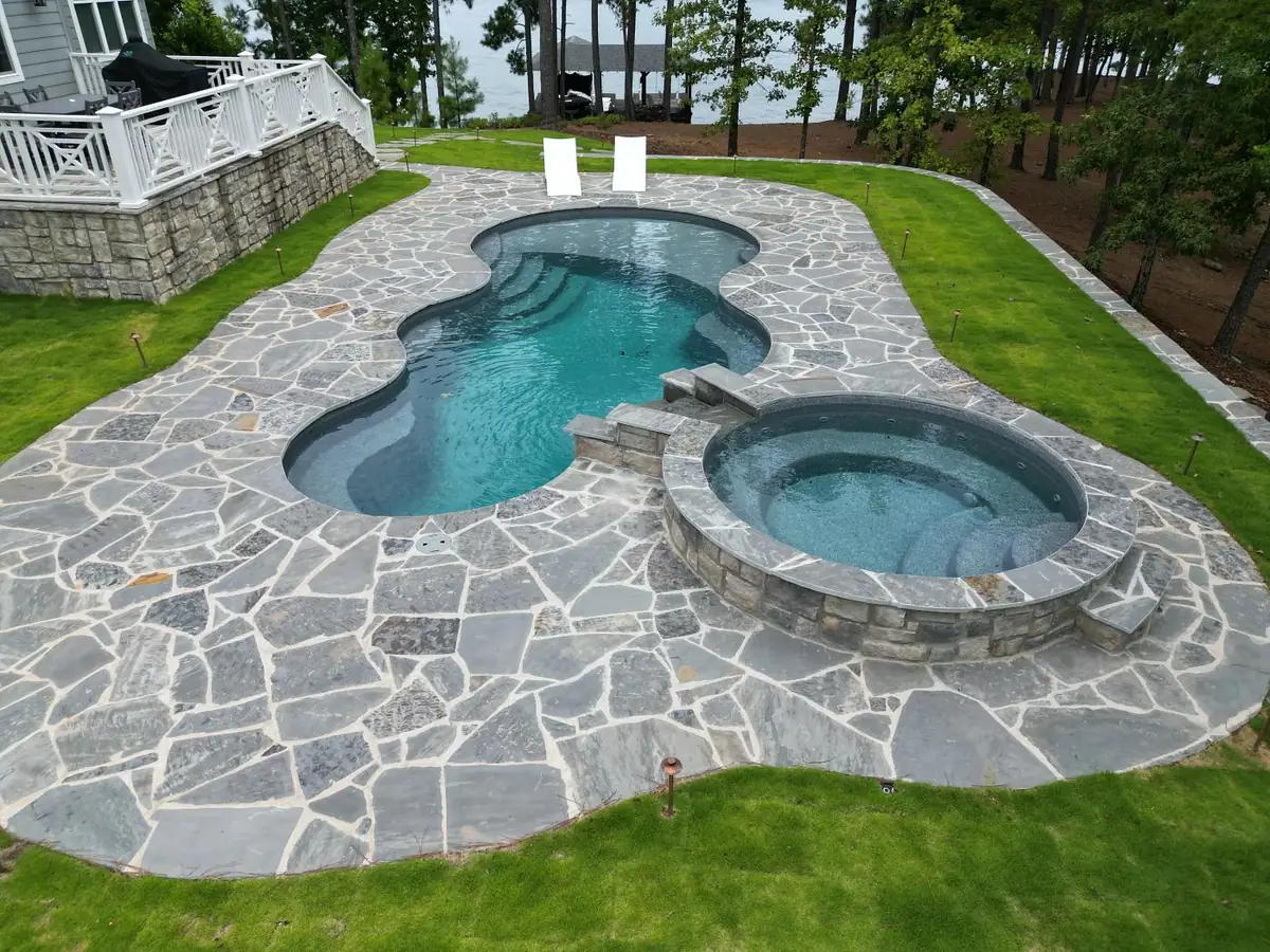 Freeform fiberglass pool and spa on a flagstone deck (Latham photo), pool company DC Pools and Spas serving Vicksburg, MS