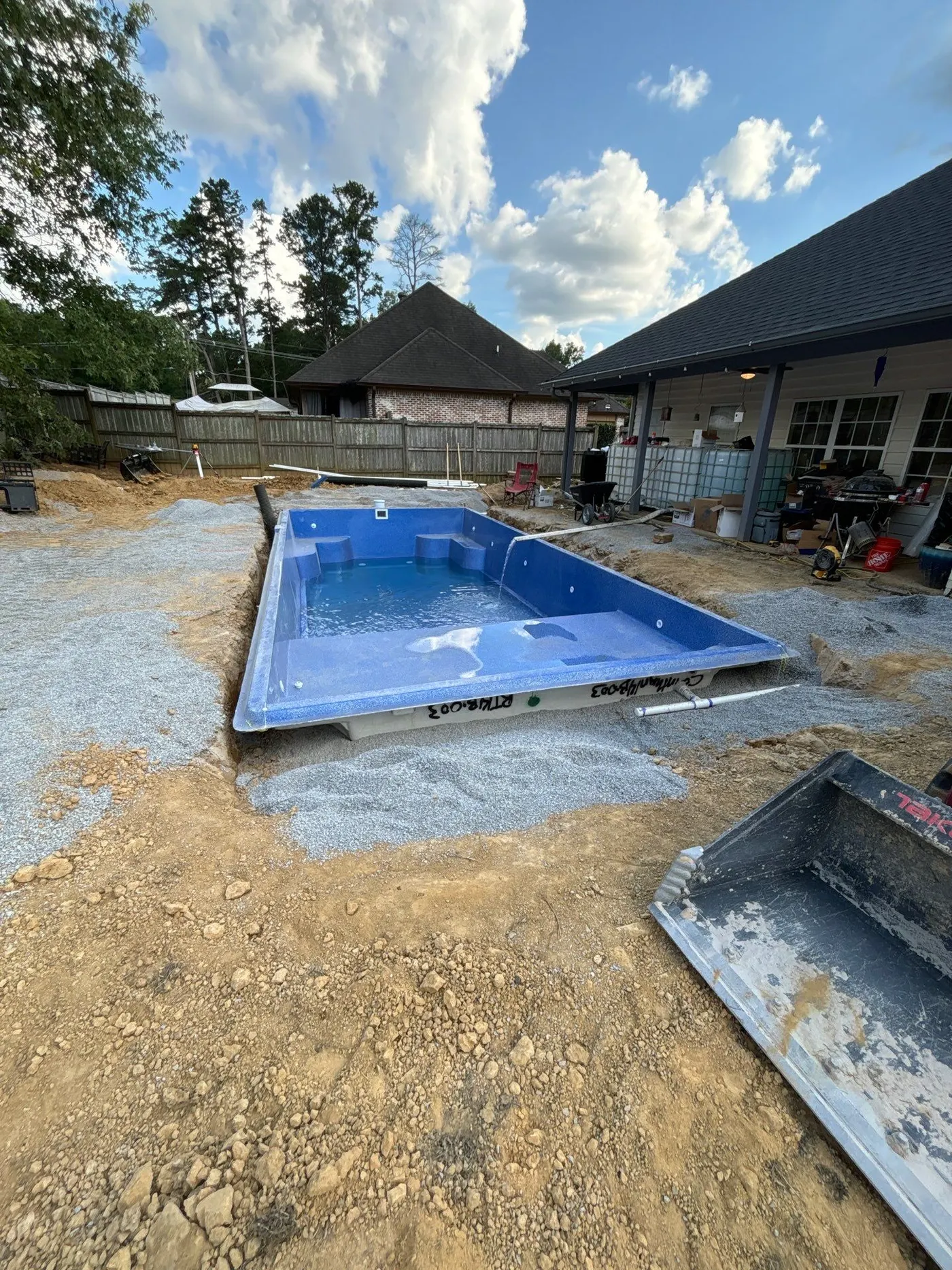 Latham fiberglass shell set into the prepared hole